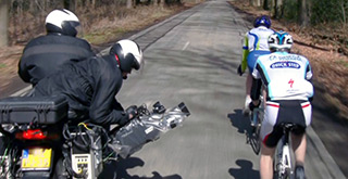 Camera operators following Amstel Gold bicycles riders on motorcycle.