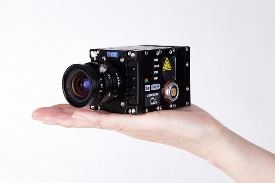 Q2m camera resting on palm of hand